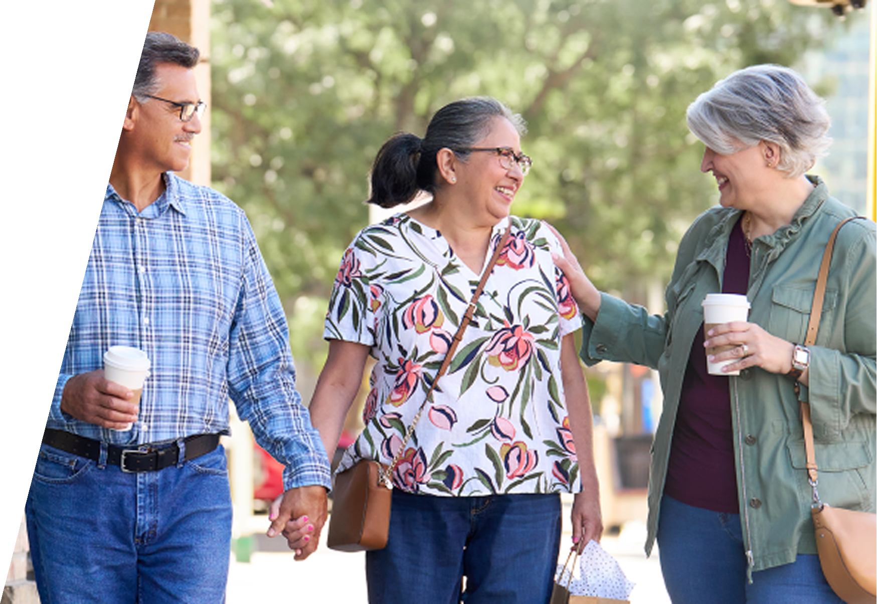 Three adults walking outdoors